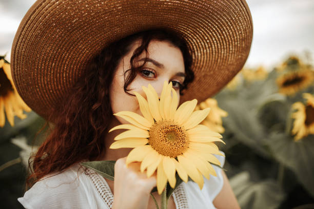 istock Summer vibes in sunflower field 1258733880