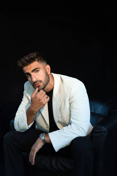 istock young business man sitting portrait 1258733907