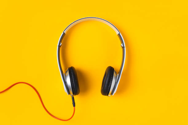 istock White headphones isolated on yellow background 1258744150