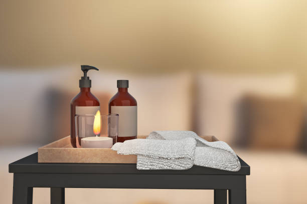 istock Aroma therapy, candle and fragrant oil set on side table, spa massage bed, Concept image for relaxation with copy space for text. 3d illustration 1258794170