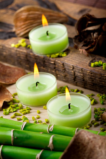 istock Green candles and small stones arrangement 125881077