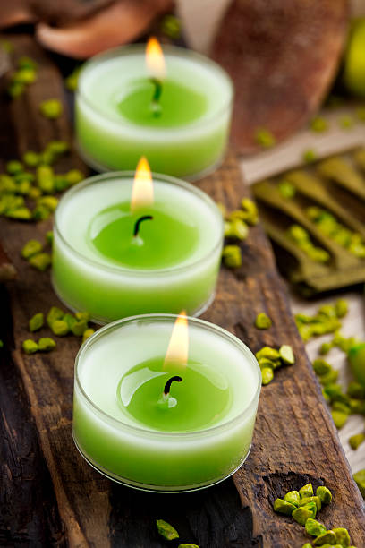 istock Green candles and small stones arrangement 125881083