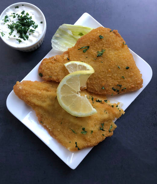 deep fried plaice fish fillet with lemon. - floe lake imagens e fotografias de stock