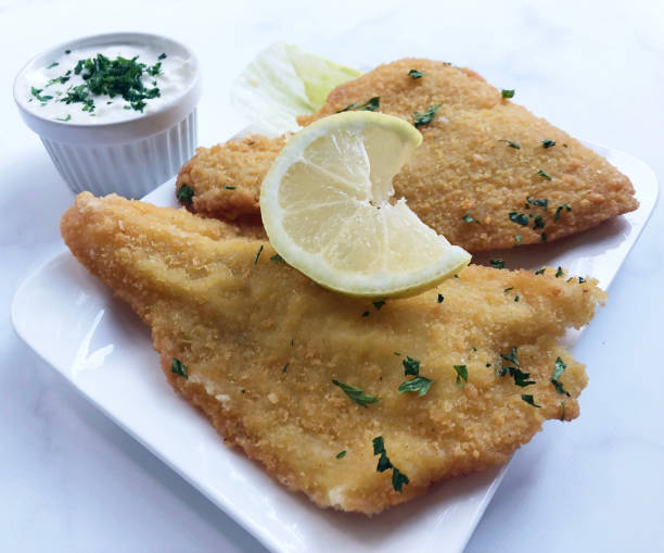 deep fried plaice fish fillet with lemon. - ice floe imagens e fotografias de stock