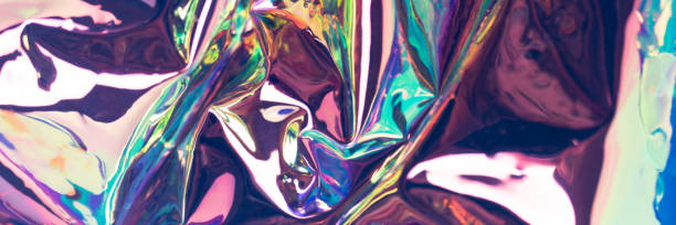 istock Multicolored glossy defocused hologram banner. Crumpled foil material. 1258825833