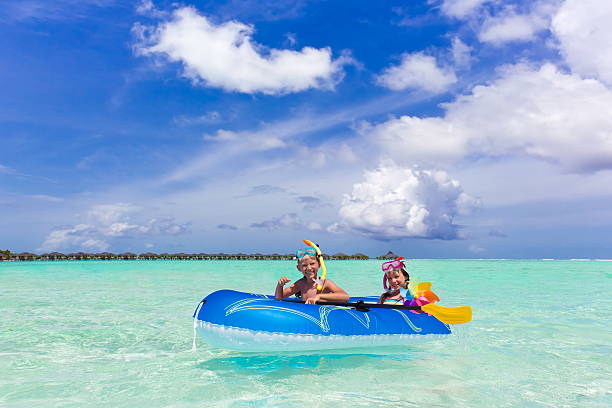 istock Boy and girl in raft 125884193