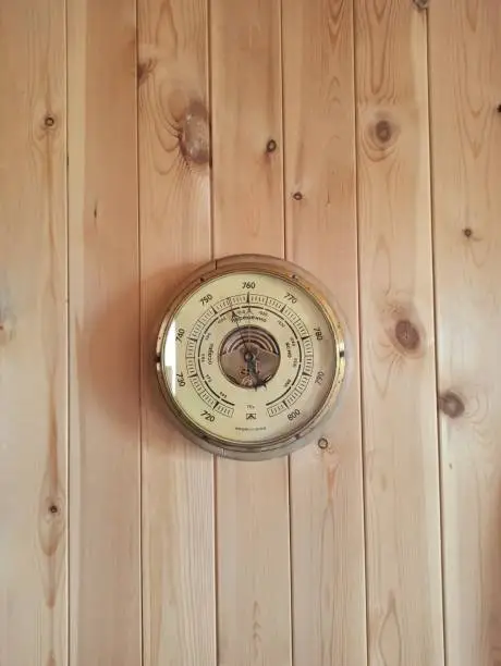 Pressure meter on a wooden wall