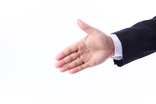 Businessman shaking hands, isolated on white background