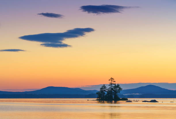 istock Peaceful Alpine Lake at Sunrise 1258874667