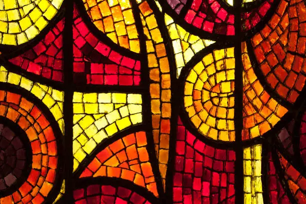 Photo of Glass mosaic layer in yellow, red and orange colors.