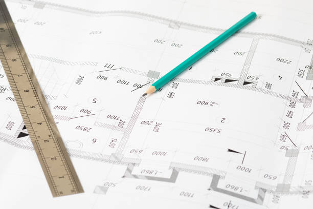 istock Architecture and construction. Workplace of the architect-architectural project, blueprints, ruler. Top view 1258900754