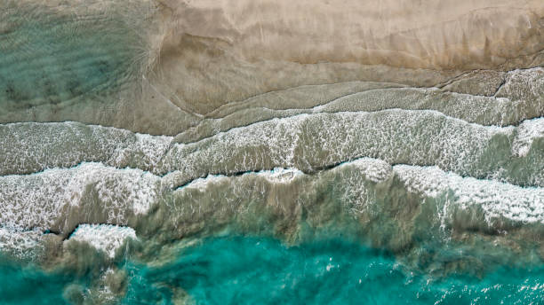 Waves and turquoise sea - drone view