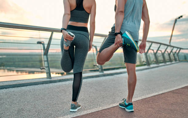 istock Couple doing sport on the street 1258908272