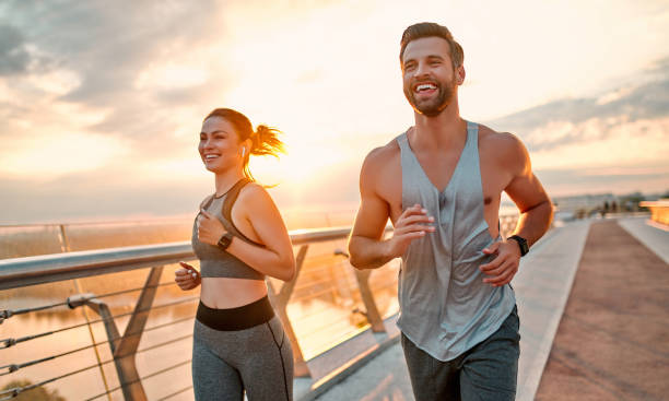 istock Couple doing sport on the street 1258908313