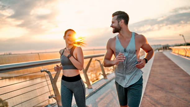 istock Couple doing sport on the street 1258908391