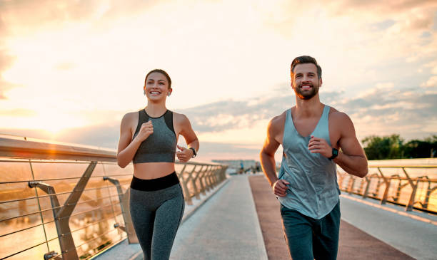 istock Couple doing sport on the street 1258908427