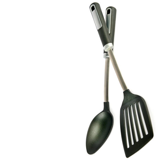 istock Kitchen spoon and spatula isolated on white background. Free space for text. 1258921106