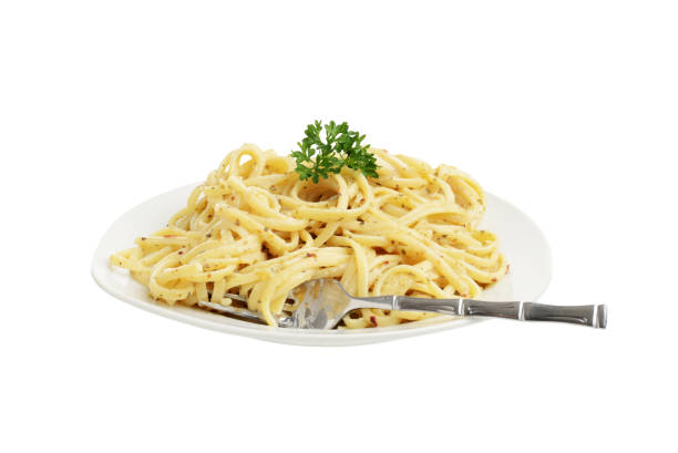 istock isolated spaghetti with white cream sauce and a fork 1258931053