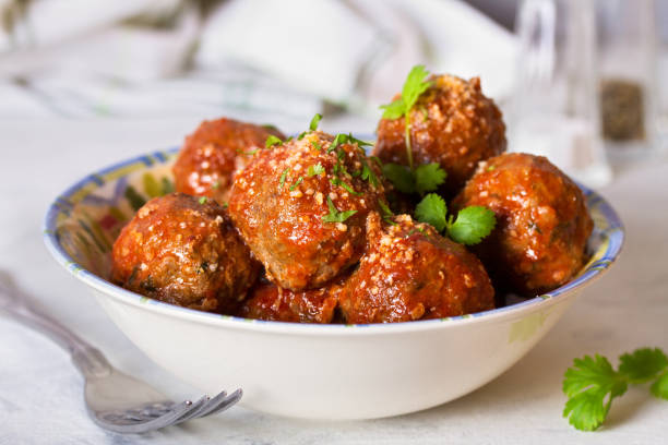 Meatballs in bowl on white background Meatballs in bowl on white background penne meatballs stock pictures, royalty-free photos & images