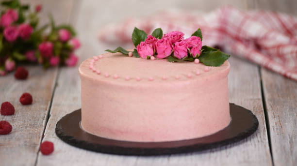 istock Layers cake with berry filling decorated with fresh roses 1258939986
