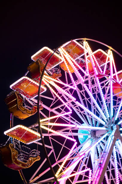 istock Ferris wheel detail, illuminated with colorful lights. 1258951201