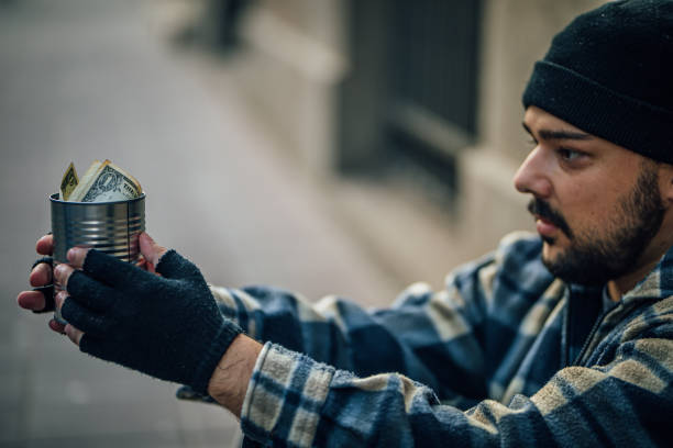 istock Homeless man begging on the street 1258998633