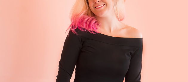 Girl  with perfect healthy pink colored hair. Fashion model woman blonde hair. Beauty fashion model girl with creative colorful dyed hair. Glamorous girl with living coral hair.