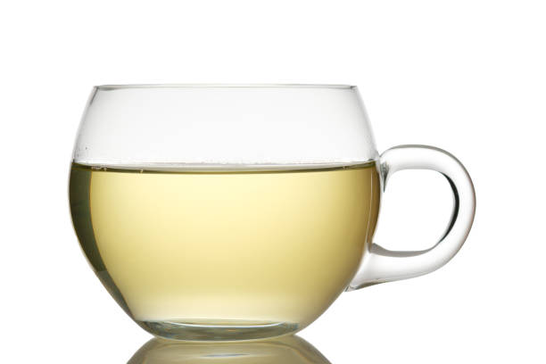 istock Glass cup of green tea white isolated 1259009750
