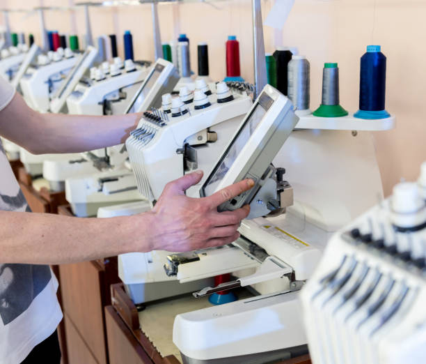 istock Fabric industry production line. Textile factory. Working tailoring process 1259011373