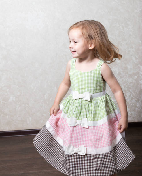 istock Cute little girl dancing, spinning in a dance, laughing 1259014182