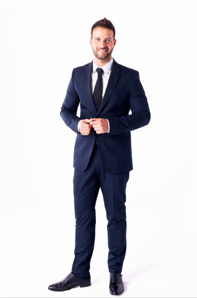 studio shot of handsome businessman wearing suit while standing at isolated white background - necktie isolated clothing white imagens e fotografias de stock