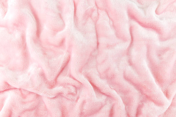istock Wrinkled pink cloth texture abstract background 1259022956