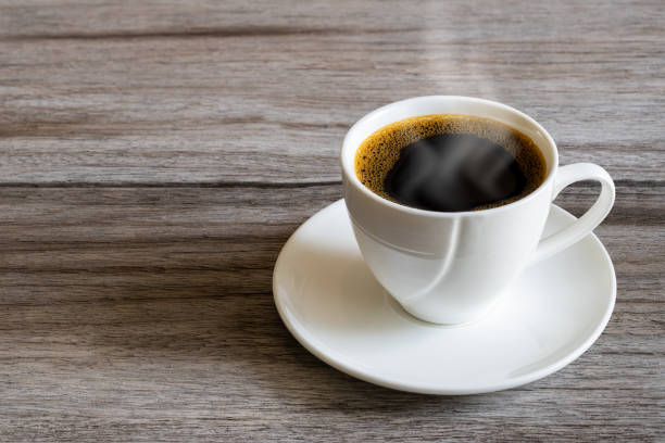 istock Hot white coffee cup on grunge vintage wooden tabletop 1259023842