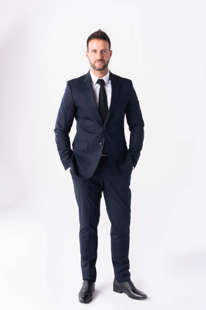 istock Studio shot of handsome businessman wearing suit while standing at isolated white background 1259026007