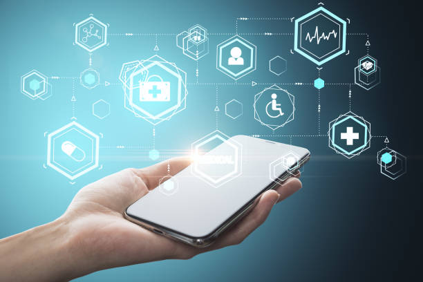 istock Hand holding smartphone with glowing medical interface 1259037767