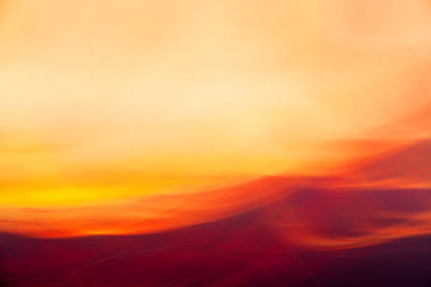 istock Red-yellow clouds on sunset shooted with camera motion. Abstract background 1259038363