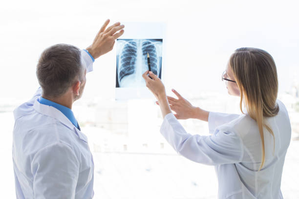 istock Doctors examining x-ray film 1259038541