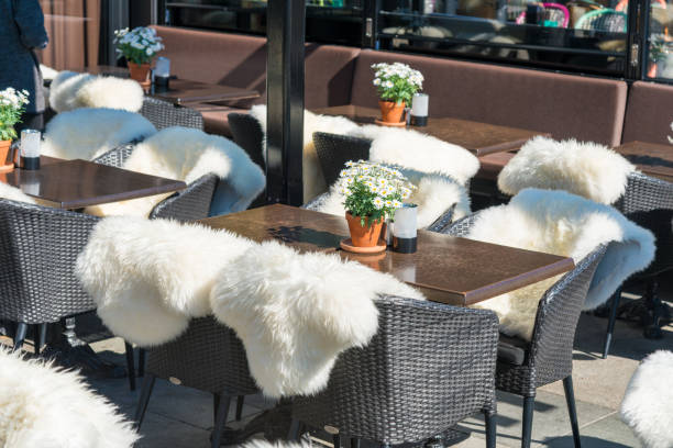 Restaurant by the street with empty chairs and tables in Oslo