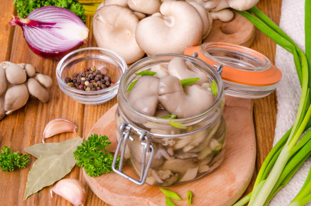 istock Marinated Oyster Mushrooms with spices in a glass jar 1259041989