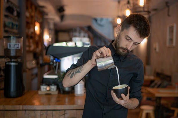 istock Barista is making coffee with milk at coffee shop. 1259042045
