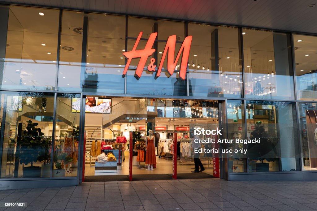 Entrance to H&M Store in Warsaw Warsaw, Poland - June 18, 2020: Entrance to H&M store, clothing retail company in the city center at night H&M Stock Photo