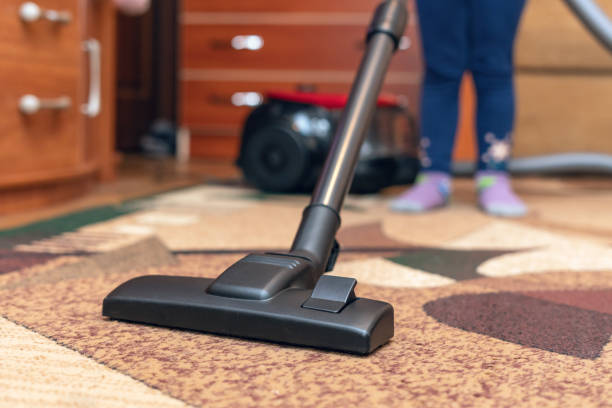 istock A small child vacuums a carpet with a vacuum cleaner 1259052306