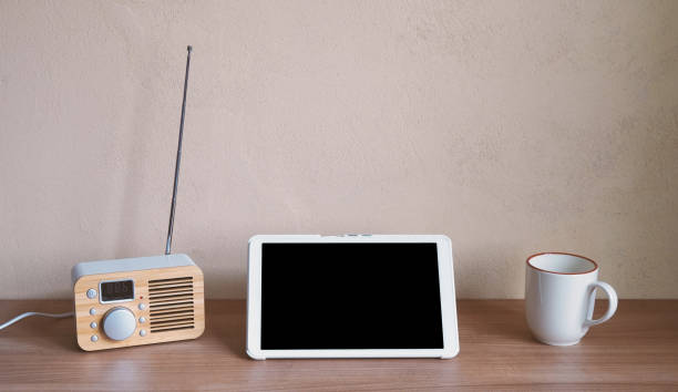istock tablet computer with retro radio and coffee cup on desk 1259057131