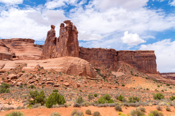 istock Three Gossips Rock Formation and Courthouse Wash in Arches National Park 1259061528