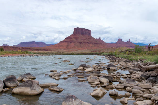 This is a view of the Colorado River running at historically low levels.  This shot was taken about 15 miles from Moab, Utah, USA along the Upper Colorado River Scenic Byway.  Along with the river can be seen the famous spires and rock formations that have been featured in many feature films and commercials.