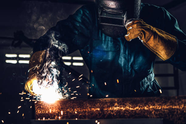 istock Metal welder working with arc welding machine. 1259066508