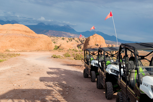 This is a lineup of off road vehicles used to traverse the slickrock trails and rocks of southern Utah.  This shot was taken on the Hell's Revenge trail east of Moab.