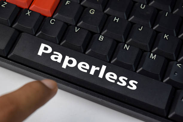Paperless isolated on laptop keyboard background. stock photo