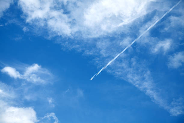 istock Beautiful sky with airplane contrails. 1259073617