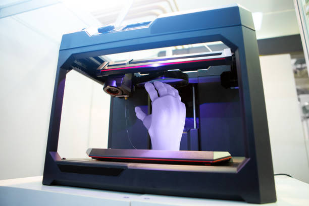Hand in 3D printer Artificial hand in 3D printer 3d printing hand stock pictures, royalty-free photos & images